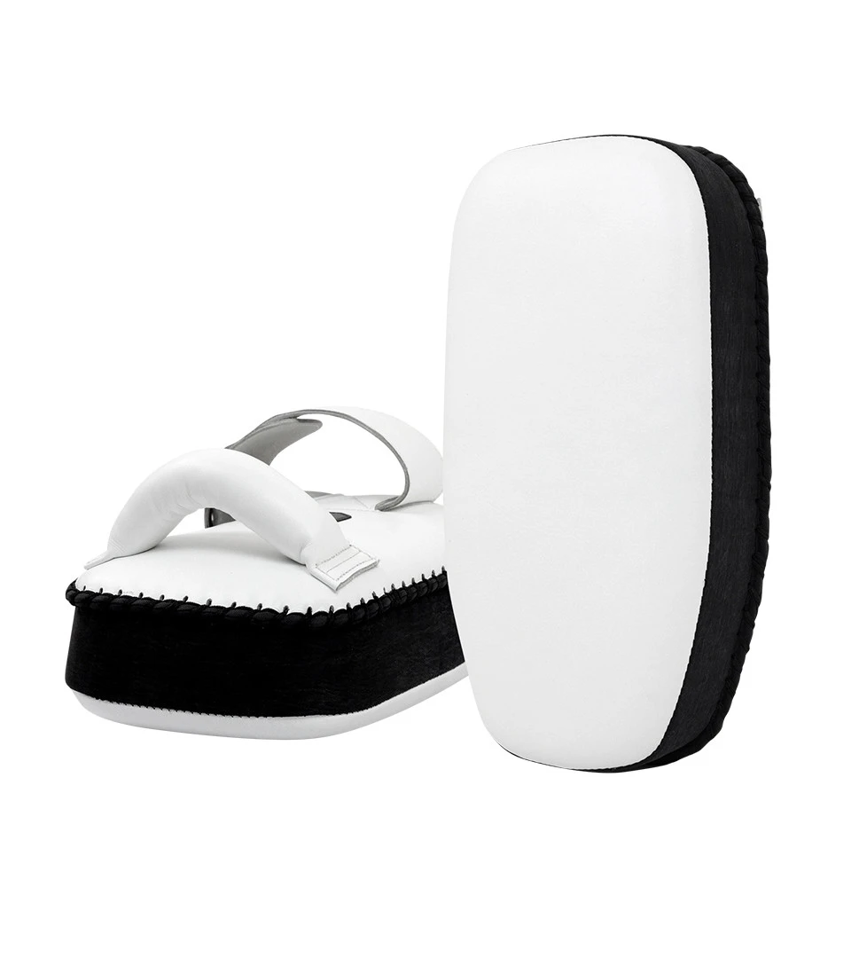 https://combatcorner.wpengine.com/wp-content/uploads/2022/12/8-THAI-PAD-Single-Strap-WHITE-with-Black-DUAL__39525.webp