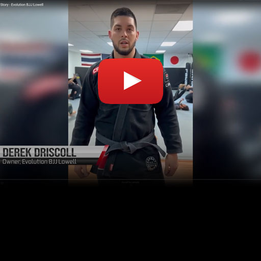 Photo of Derek Driscoll, the owner of an elite gym, training and giving a positive testimonial review for his gym's custom rash guards from Combat Corner.