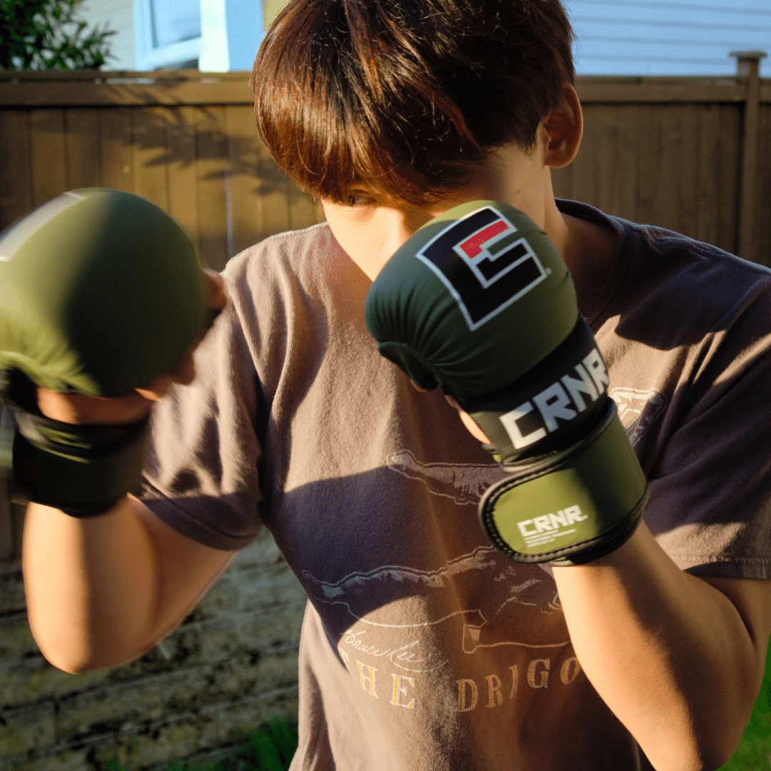 Photo a Combat Corner brand ambassador and MMA athlete training with Combat Corner MMA Spar Gloves.