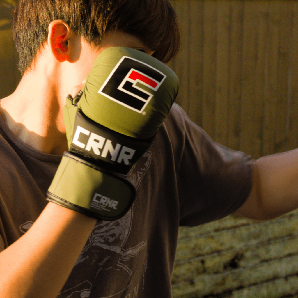 Photo a Combat Corner brand ambassador and MMA athlete training with Combat Corner MMA Spar Gloves.
