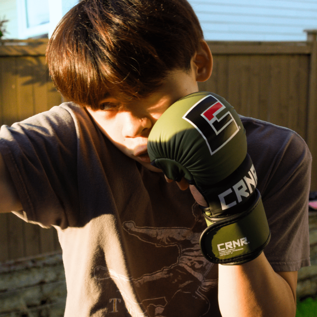 Photo a Combat Corner brand ambassador and MMA athlete training with Combat Corner MMA Spar Gloves.