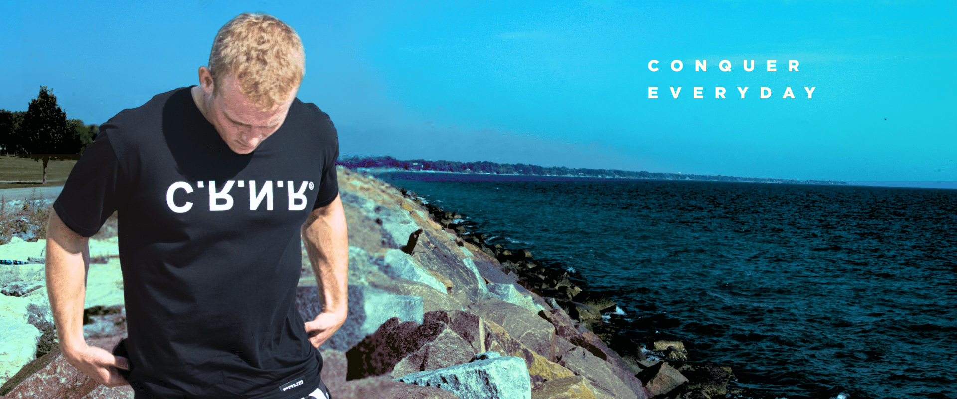 Photo of a young man wearing Combat Corner's new t-shirt, the CRNR UP DN OUT IN T-Shirt.