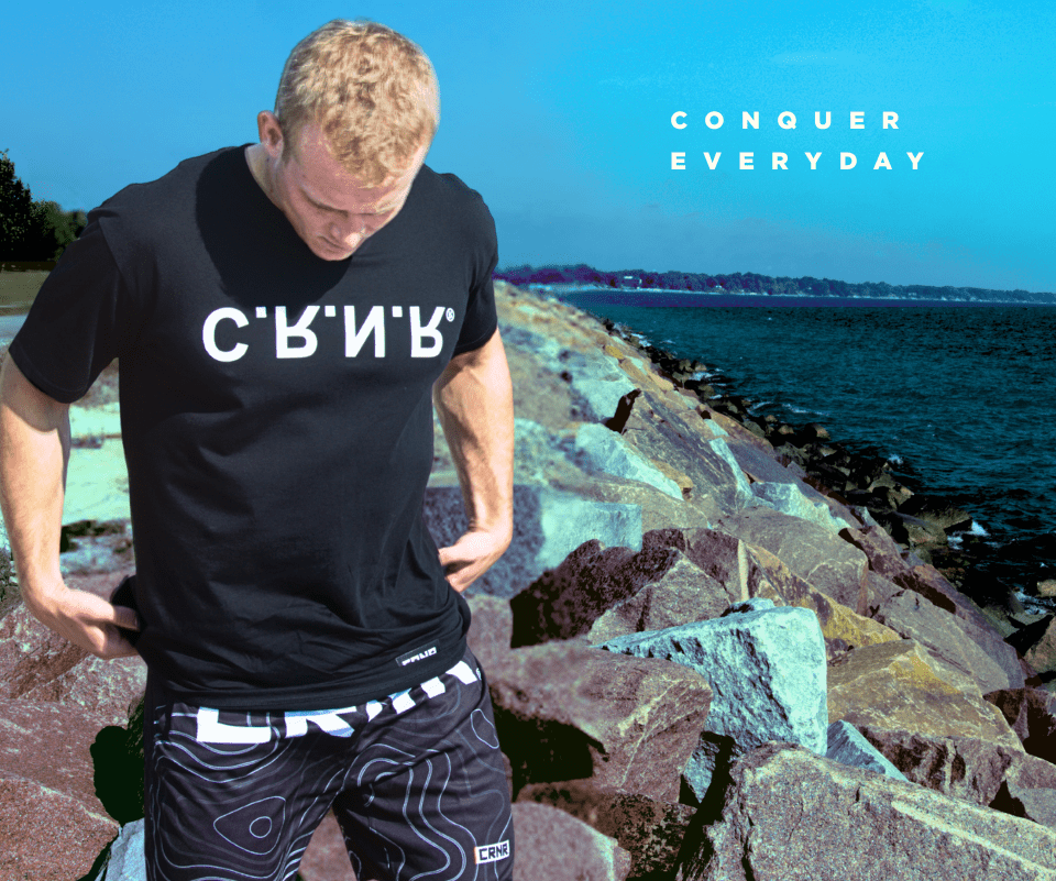Photo of a young man wearing Combat Corner's new t-shirt, the CRNR UP DN OUT IN T-Shirt.