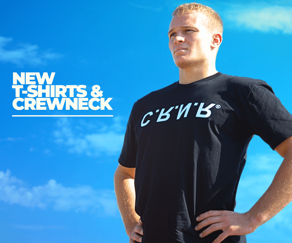 Photo of Combat Corner's new t-shirts. The photo shows a young man wearing the new CRNR UP DN IN OUT T-shirt.